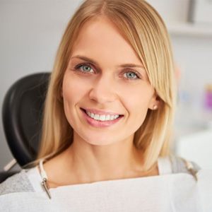 Close-up portrait of smiling female dental patient